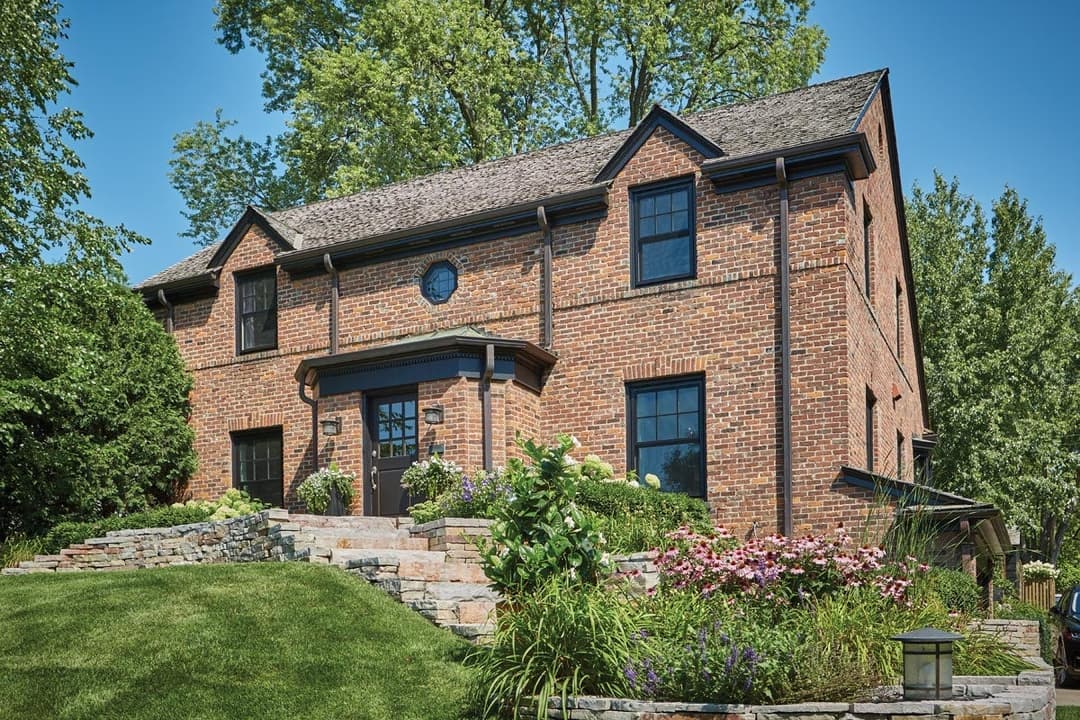 on the left black double hung windows with divider lites,